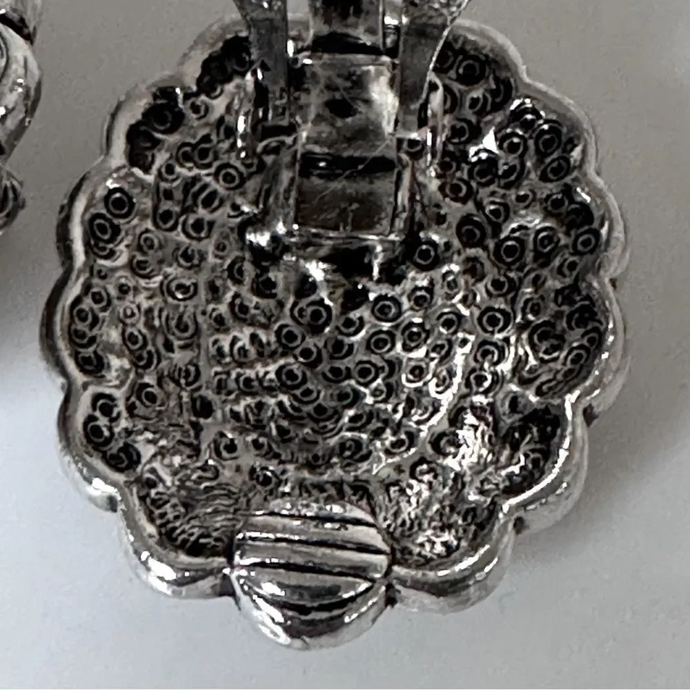 Vintage Sterling Silver Oval Clip-On Earrings with a black stone.